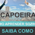 Capoeirista jogando capoeira - ao fundo a cidade de Salvador Bahia